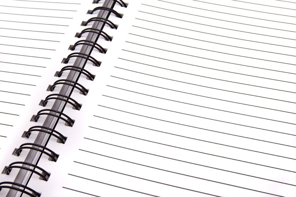 A blank page in an open spiral notebook