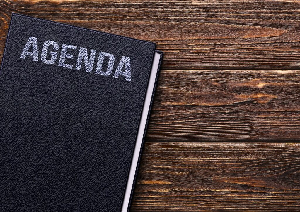 An agenda notebook on a wooden desk, representing content and blog planning