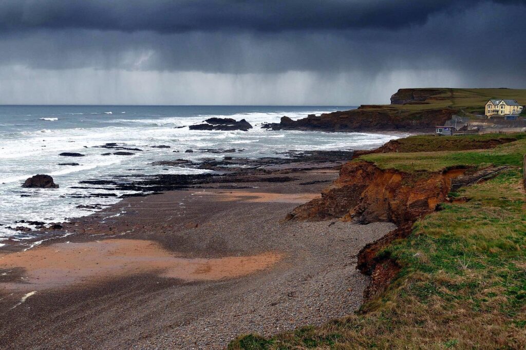 A Cornwall beach and coastline near a small hospitality business on the clifftop